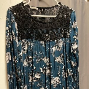 Lace neck, long sleeve blouse.